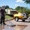 Cleaning road with Bowser pressure washer